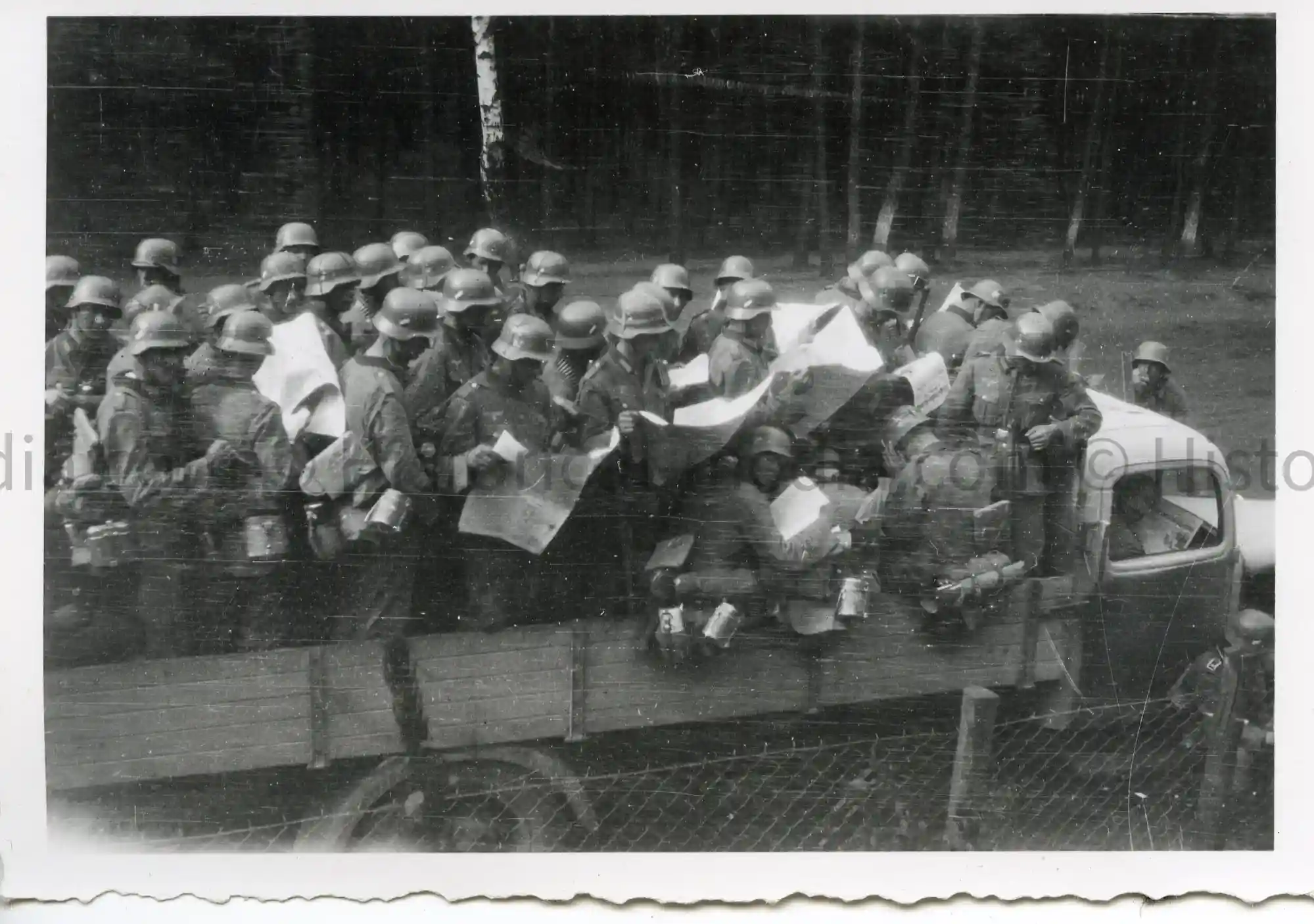WWII GERMAN PHOTO TRUCK LOAD OF GERMAN SOLDIERS READING NEWSPAPERS