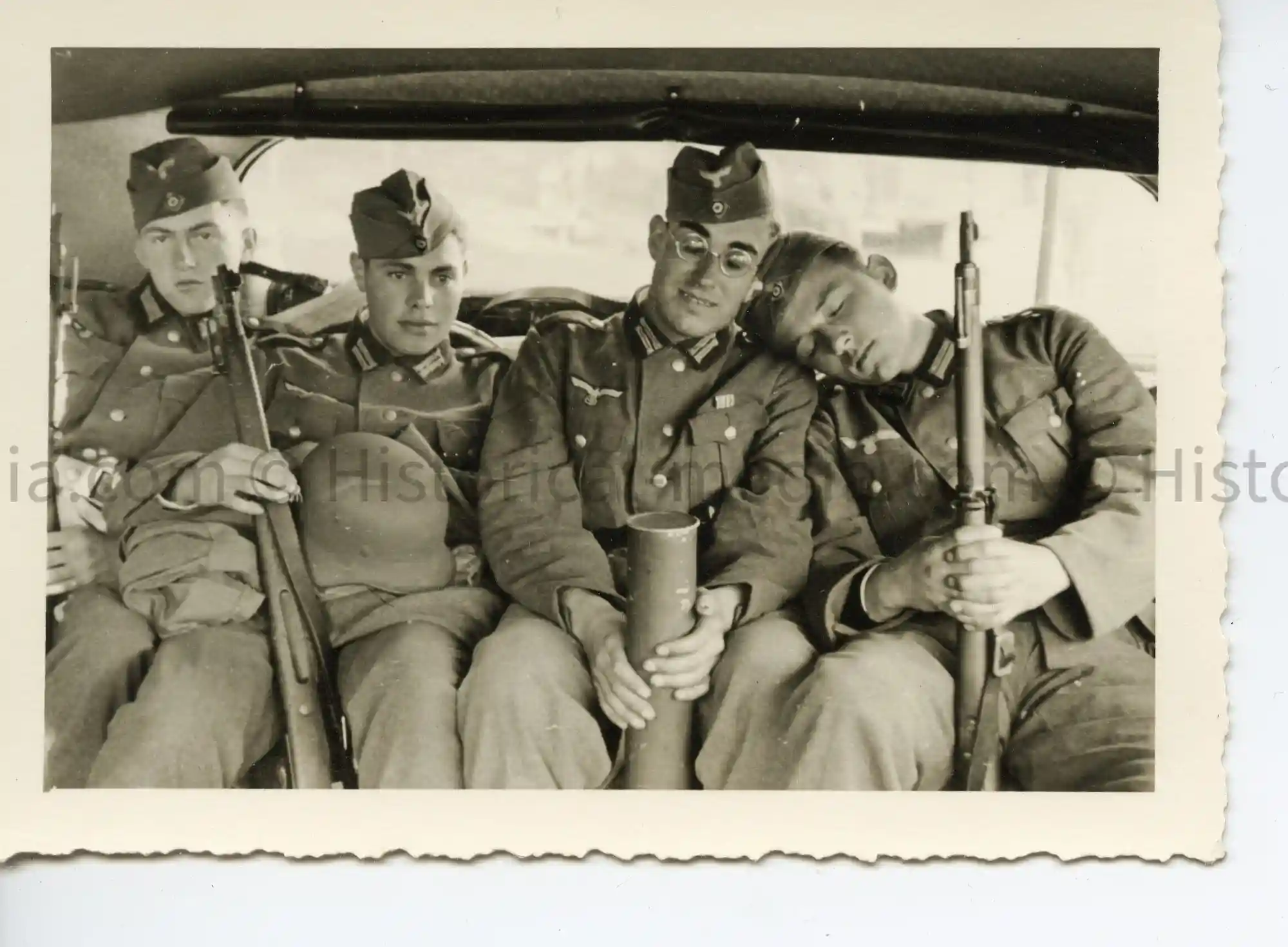 PHOTOS OF GERMAN SOLDIERS DOZING IN BACK OF CAR