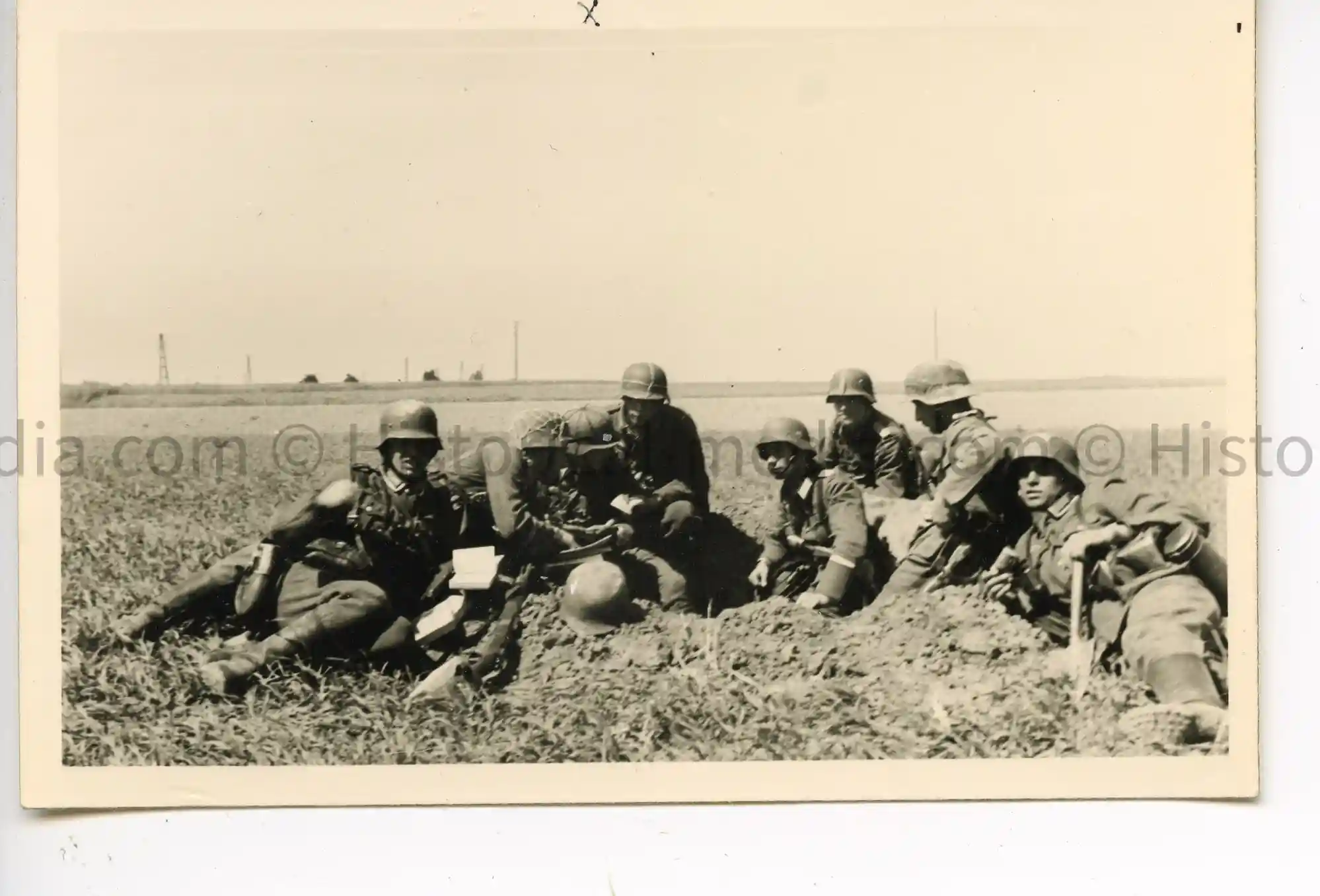 WWII GERMAN PHOTO SOLDIERS IN FOXHOLE IN THE FIELD - FRANCE 1940 - HELMET STRAP VARIATIONS - 2 WWII GERMAN PHOTO SOLDIERS IN FOXHOLE IN THE FIELD - FRANCE 1940 - HELMET STRAP VARIATIONS - 2