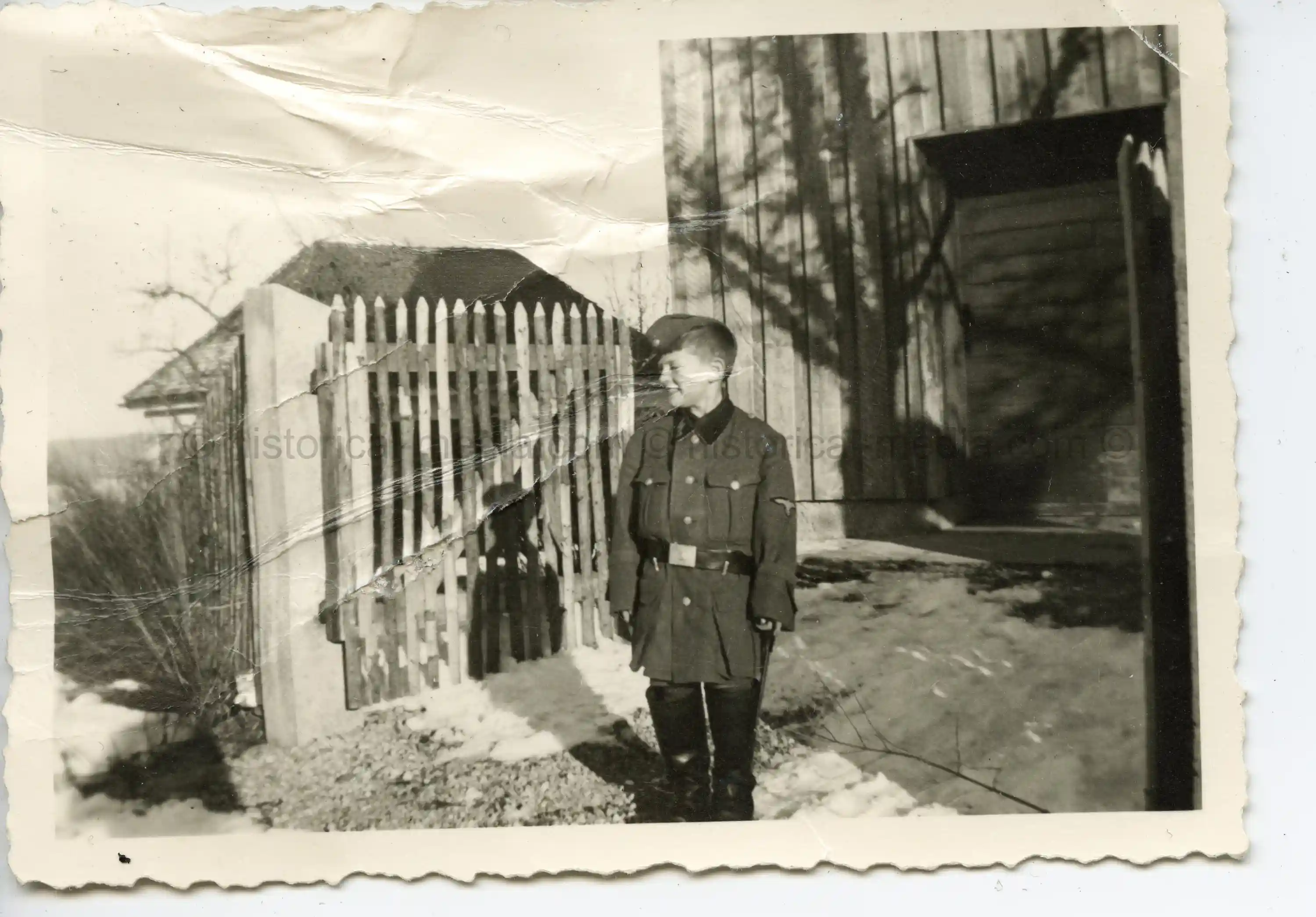 BOY POSES IN WAFFEN-SS UNIFORM