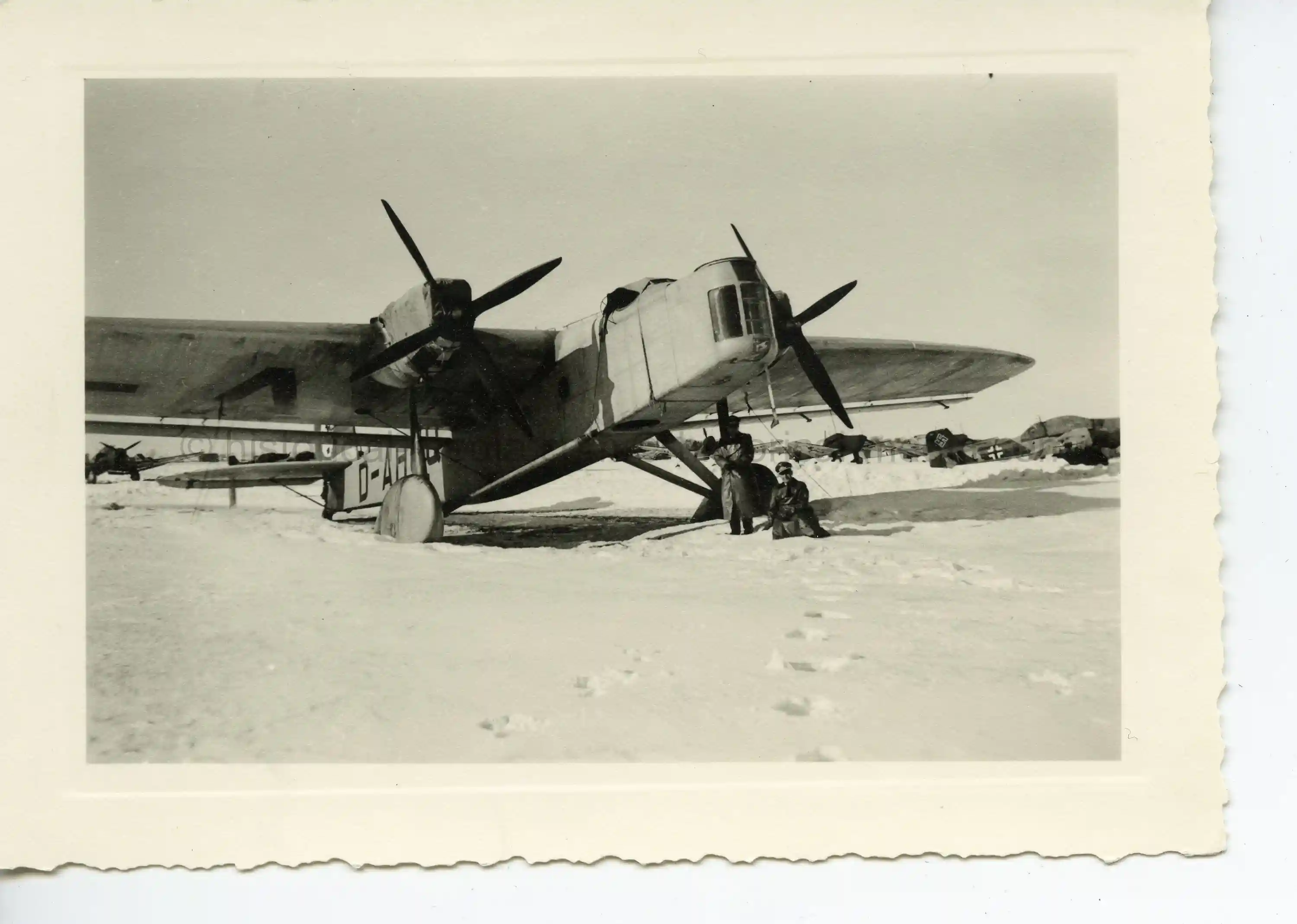 GERMAN PHOTO OF DO 23 AIRPLANE IN THE FIELD IN WINTER