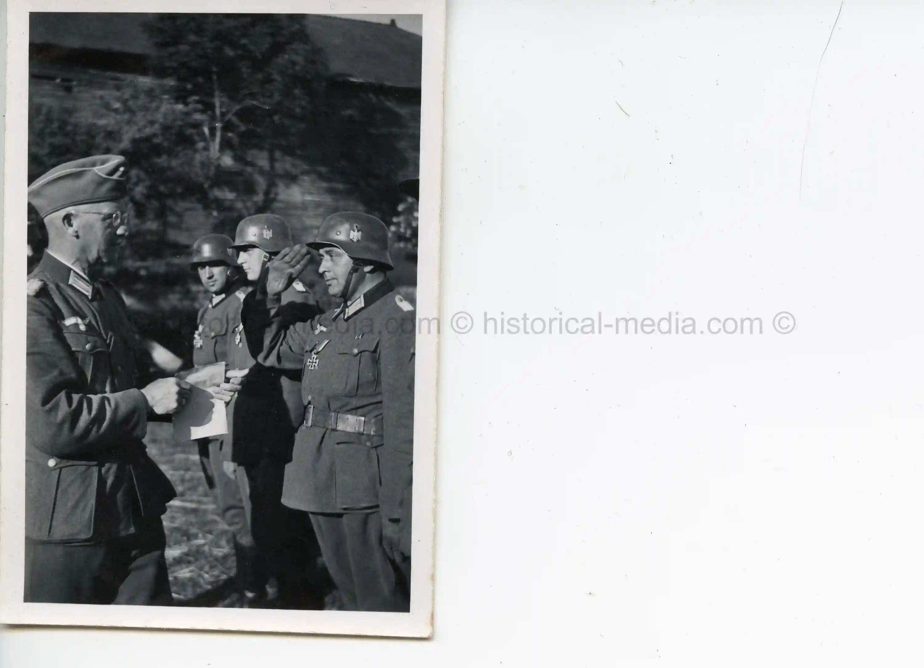 PHOTO OF OFFICER BEING AWARDED THE IRON CROSS - MEDAL & DOCUMENT