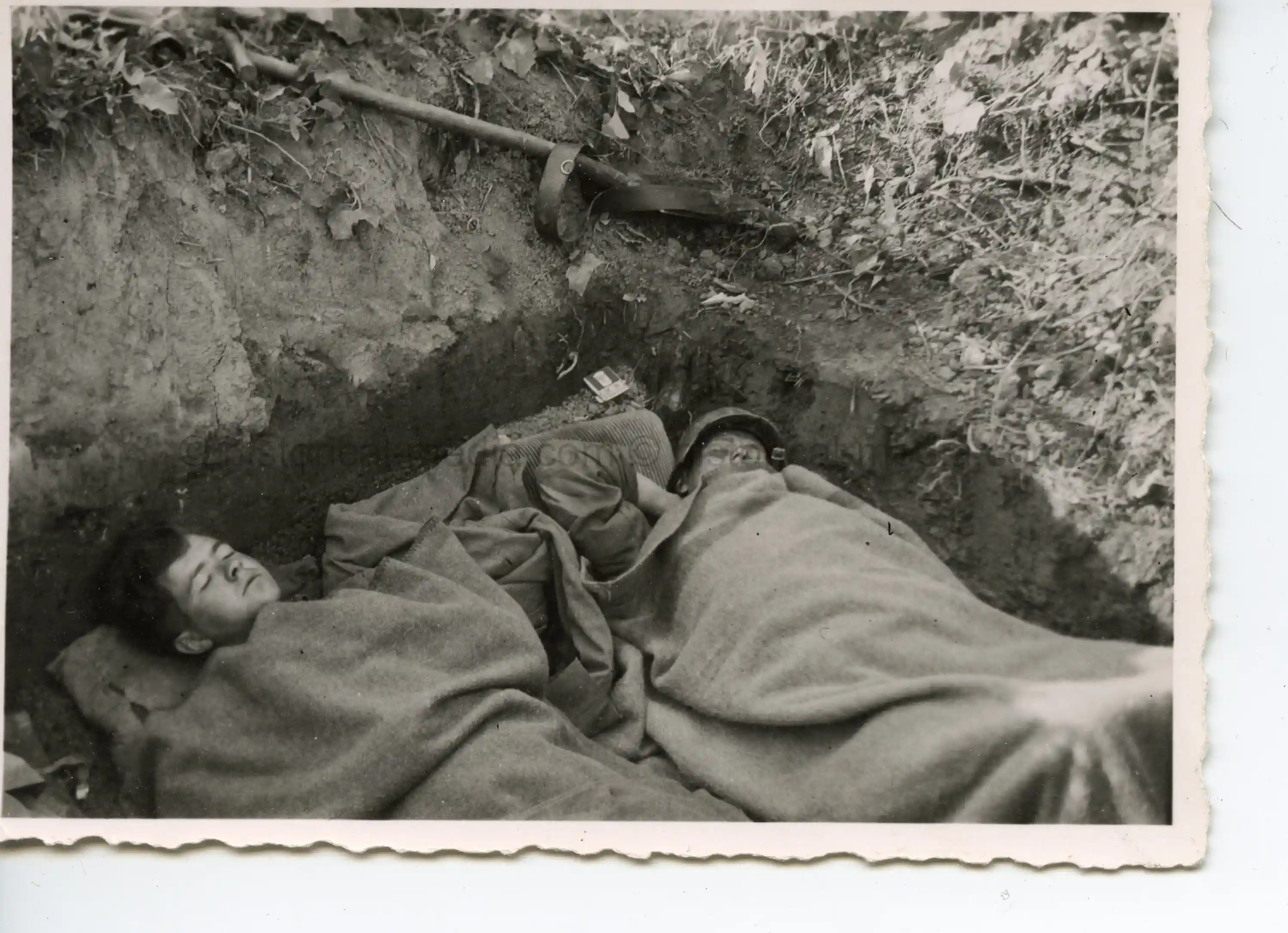 PHOTO OF GERMAN SOLDIERS SLEEPING IN FOXHOLE