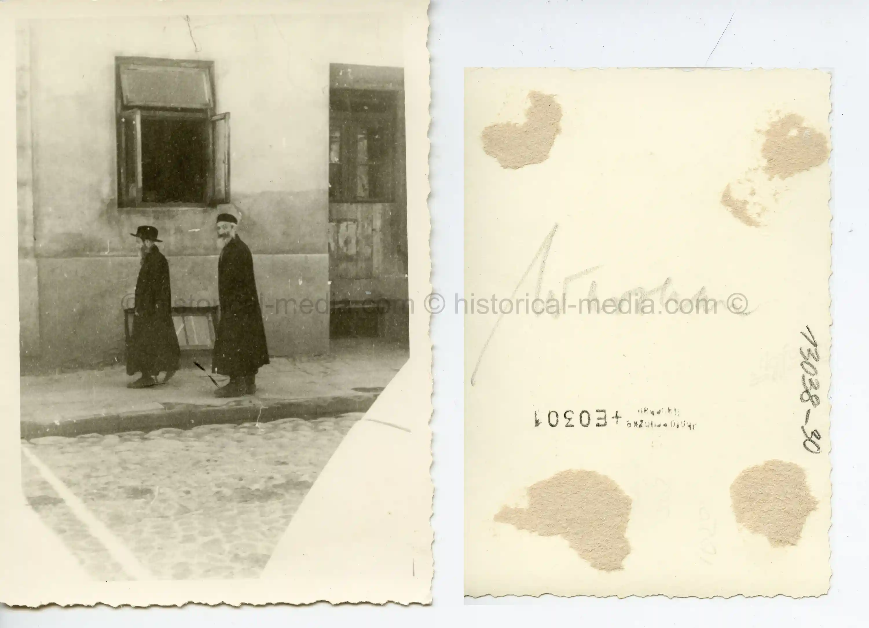 PHOTO OF WARSAW JEWS TAJEN BY GERMAN SOLDIER IN GHETTO