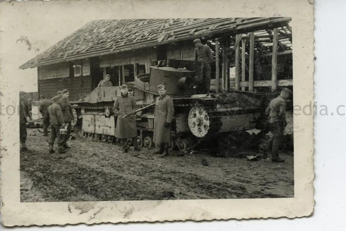PHOTO OF GERMAN SOLDIERS POSING BY KNOCKED OUT RUSSIAN TANK